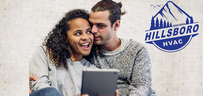 Happy couple enjoying indoor comfort with Hillsboro HVAC heating and cooling services in Oregon